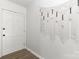 Bright entryway featuring a white paneled door and a decorative macrame wall hanging at 4083 Hord Rd, Sharon, SC 29742