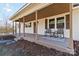 Inviting front porch with rocking chairs, a stylish rug, and great curb appeal at 4083 Hord Rd, Sharon, SC 29742