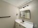 Bathroom featuring a shower over tub, white vanity, and modern finishes at 4232 Cornelia Ln, Rock Hill, SC 29732