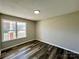 Bright bedroom with a large window and wood-look floors at 4232 Cornelia Ln, Rock Hill, SC 29732