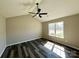 Bright bedroom with a ceiling fan, large window, and wood-look floors at 4232 Cornelia Ln, Rock Hill, SC 29732
