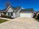 Charming single-story home with a two-car garage, green lawn, and a well-maintained yard at 4232 Cornelia Ln, Rock Hill, SC 29732