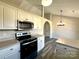 Well-lit kitchen featuring stainless steel appliances, light countertops, and modern cabinets at 4232 Cornelia Ln, Rock Hill, SC 29732