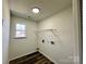 Laundry room including a wire rack, and window for ample natural lighting at 4232 Cornelia Ln, Rock Hill, SC 29732