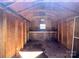 Interior view of the wooden shed featuring shelving and visible framing at 4232 Cornelia Ln, Rock Hill, SC 29732