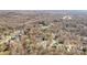Aerial shot showcasing the property's location within a leafy neighborhood near other homes and amenities at 4828 Beth Ln, Harrisburg, NC 28075