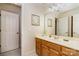 Bright bathroom features framed mirror, tile floor, and door to closet area at 4828 Beth Ln, Harrisburg, NC 28075