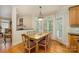 Bright dining area with natural light, a view of the living room, and contemporary lighting at 4828 Beth Ln, Harrisburg, NC 28075