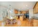 Eat-in kitchen view featuring stainless appliances, granite counters, wood cabinets, and a breakfast area at 4828 Beth Ln, Harrisburg, NC 28075