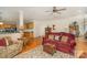 Open concept living room with hardwood floors, view to kitchen, and elegant traditional decor at 4828 Beth Ln, Harrisburg, NC 28075