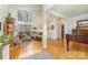 Expansive living room features a wall of windows, hardwood floors, white columns, and a grand staircase at 4828 Beth Ln, Harrisburg, NC 28075