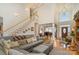 Inviting living room showcasing hardwood floors, high ceilings, a grand staircase, and an open floor plan at 4828 Beth Ln, Harrisburg, NC 28075