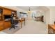 Bright home office with custom built-ins, work space, storage, and natural light at 4828 Beth Ln, Harrisburg, NC 28075