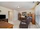 Comfortable home office with leather reclining chair and custom wood accents at 4828 Beth Ln, Harrisburg, NC 28075