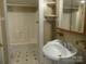 Classic bathroom featuring a shower-tub combo, sink with mirror, and vintage tile floor at 516 W 7Th St, Kannapolis, NC 28081