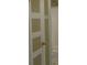 Charming bathroom door featuring decorative inset glass panels and a brass door knob at 516 W 7Th St, Kannapolis, NC 28081