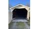 Garage featuring a sturdy frame and concrete floor, offering ample space for parking and storage in a functional design at 516 W 7Th St, Kannapolis, NC 28081