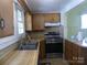 Kitchen features wood counters, stainless steel appliances, and natural light at 516 W 7Th St, Kannapolis, NC 28081