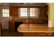 Classic kitchen features wood counters, window over sink and stainless steel faucet at 516 W 7Th St, Kannapolis, NC 28081