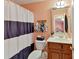 Bathroom features a shower with a curtain, vanity, and decorative hand towels at 5405 Silver Creek Dr, Waxhaw, NC 28173