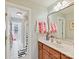 Bathroom vanity with sink, mirror, and view to connected rooms at 5405 Silver Creek Dr, Waxhaw, NC 28173