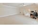 Bright bonus room features neutral carpeting, a built-in desk, and easy access to storage space at 5405 Silver Creek Dr, Waxhaw, NC 28173