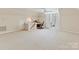 Bright bonus room features neutral carpeting, a built-in desk, and easy access to storage space at 5405 Silver Creek Dr, Waxhaw, NC 28173