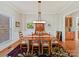 Elegant dining room with hardwood floors, rug and wainscoting at 5405 Silver Creek Dr, Waxhaw, NC 28173