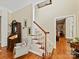 Elegant entryway with staircase, hardwood floors, and classic furnishings at 5405 Silver Creek Dr, Waxhaw, NC 28173