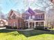 Beautiful brick home featuring a covered front porch and lush green lawn at 5405 Silver Creek Dr, Waxhaw, NC 28173