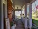 Cozy covered porch with rocking chairs and charming decor at 5405 Silver Creek Dr, Waxhaw, NC 28173