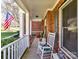 Inviting covered porch with classic rocking chair at 5405 Silver Creek Dr, Waxhaw, NC 28173