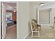 Hallway view leading to a bedroom, featuring neutral colors and classic decor at 5405 Silver Creek Dr, Waxhaw, NC 28173
