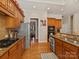 Updated kitchen with stainless steel appliances, granite countertops, and custom cabinetry at 5405 Silver Creek Dr, Waxhaw, NC 28173