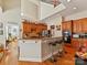 Open kitchen with granite countertops, stainless steel appliances, and a breakfast bar at 5405 Silver Creek Dr, Waxhaw, NC 28173
