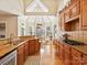 Well-appointed kitchen featuring hardwood floors, granite counters, and ample cabinet space at 5405 Silver Creek Dr, Waxhaw, NC 28173