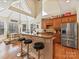 Stylish kitchen boasts granite counters, stainless appliances, a breakfast bar, and hardwood floors at 5405 Silver Creek Dr, Waxhaw, NC 28173