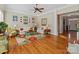 Bright living room with hardwood floors, neutral walls, and classic white trim at 5405 Silver Creek Dr, Waxhaw, NC 28173
