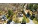 Aerial view of home situated on a spacious lot, surrounded by mature trees and a well-maintained landscape at 7306 Timbercreek Ct, Denver, NC 28037