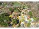 Aerial view of homes nestled among mature trees and lush landscaping at 7306 Timbercreek Ct, Denver, NC 28037