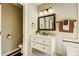 Bathroom featuring a classic vanity with marble countertop and a framed mirror at 7306 Timbercreek Ct, Denver, NC 28037