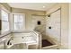 Bathroom featuring a luxurious soaking tub and separate glass-enclosed shower at 7306 Timbercreek Ct, Denver, NC 28037