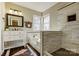 Bright bathroom featuring natural light, modern tiling, a shower, and a soaking tub at 7306 Timbercreek Ct, Denver, NC 28037