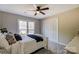 Bedroom with neutral walls, large window, closet, and carpeted floor at 7306 Timbercreek Ct, Denver, NC 28037