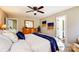 Spacious bedroom featuring neutral walls, a ceiling fan, and natural light at 7306 Timbercreek Ct, Denver, NC 28037