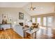 Bright living room with vaulted ceilings, fireplace, and sliding doors to the outside at 7306 Timbercreek Ct, Denver, NC 28037