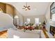 Cozy living room with hardwood floors, fireplace, and a staircase leading to the upper level at 7306 Timbercreek Ct, Denver, NC 28037