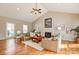Spacious living room with vaulted ceilings, fireplace, and large windows for natural light at 7306 Timbercreek Ct, Denver, NC 28037