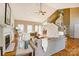 Open living room showcasing a fireplace, staircase, and seamless access to other areas at 7306 Timbercreek Ct, Denver, NC 28037