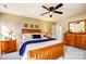 Inviting main bedroom features a ceiling fan and ample natural light at 7306 Timbercreek Ct, Denver, NC 28037